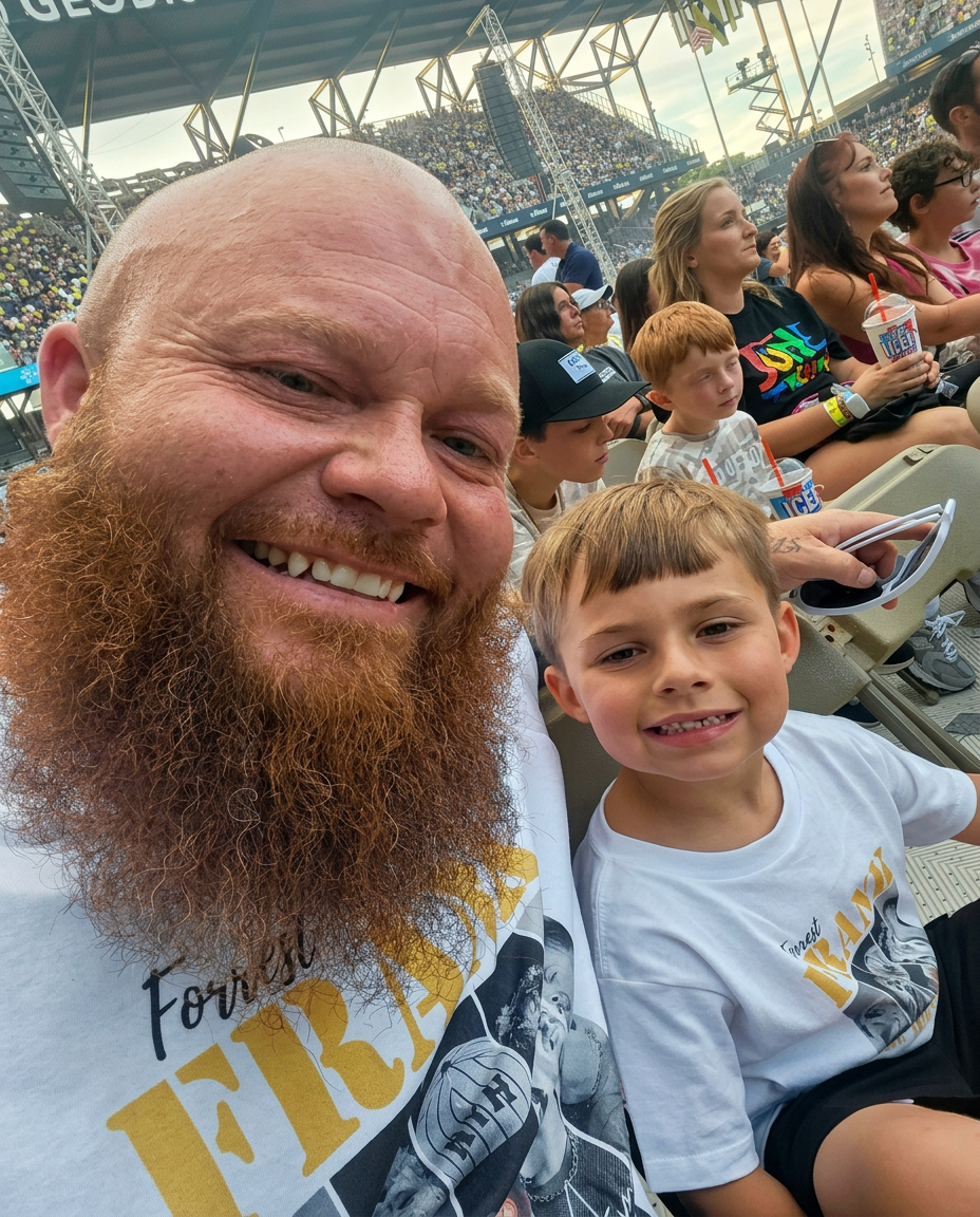 James Smotherman with his son at a game